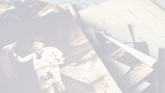 Vintage family photographs on a soft linen background — symbolizing memory and legacy.